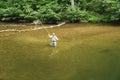 Fisherman Casting Fly to a Rising Trout Royalty Free Stock Photo